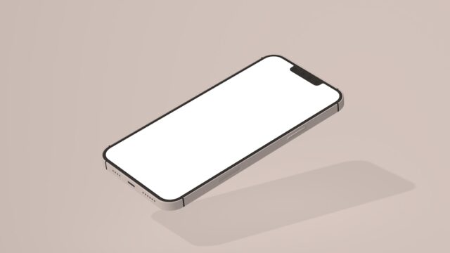 ベージュ背景に置かれた画面が白紙のスマートフォンのモックアップ写真